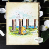 Winnie the Pooh sits reading beneath tall pines by the water, softly colored on a distressed panel — 'I love your story.'