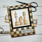 Checkerboard card with stamped chess pieces, 'Happy Birthday from all of us.'
