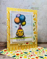 Yellow card with a fuzzy chick in a party hat holding balloons, 'just a little hello on your birthday.'