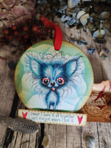 Round wood ornament with a blue-toned Chihuahua and a red ribbon