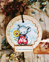 A cute mouse in overalls holding a flower hand-stamped on a card and lettered "Sending a little love your way."