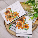 Angie Blom's cluster of tiger lilies with 'With sympathy,' a comforting red rubber floral stamp shown on a handmade sympathy card.