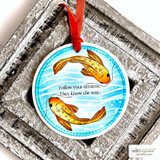 Round ornament card with two koi swimming and 'Follow your dreams. They know the way'.