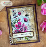 Mixed media card of pink blossoms with a bee over sky-blue collage. Sweet as honey banner.