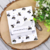 Bee-patterned card background made by repeating the small bee stamp, with sentiment strip