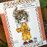 Card with the tired girl colored in a yellow robe holding coffee, captioned 'take it just one cup at a time.'