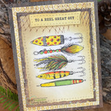 Netting-bordered card of three stacked lures under 'To a reel great guy'