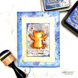 Card with a cat clinging to a wall on a blue background, "Just keep hangin on," ink pads nearby