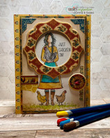 The woman framed in a circle aperture on an ornate autumn-toned card, with "Just chicken in!"