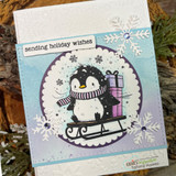 Snowflake-embossed card with the sledding penguin in purple circle. Sending holiday wishes.