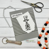 Card with a sketched top-hat ghoul on black chevron paper, "Happy Halloween," with scissors