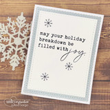Ivory card on weathered wood, stamped snowflakes and the sentiment “may your holiday breakdown be filled with joy” in script.