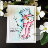 Handmade card featuring a top-hatted snowman in a scarf, with the sentiment "Sending Christmas smiles."