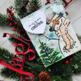 Handmade card featuring a top-hatted snowman in a scarf, with the sentiment "Sending Christmas smiles."