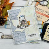 Autumn card of the girl reading on books over layered fall papers, stamped 'Just one more chapter.'