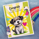 Card using the Distressed Tickets dies — a bright sunburst behind a puppy with 'Congrats on your new furry friend!'