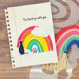 Notebook-style card with a cat silhouette and rainbow, 'Our hearts go out to you.'