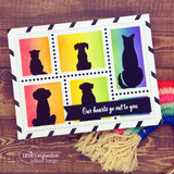 Card with dog and cat silhouettes in rainbow-colored squares, 'Our hearts go out to you.'