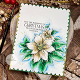 Scalloped card with two cream and green poinsettias under “MAY THE BLESSINGS OF CHRISTMAS FILL YOUR HOME WITH JOY,” on rustic wood.