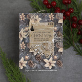 Neutral card with tone-on-tone poinsettias, pinecones and a tag reading “MAY THE SPIRIT OF CHRISTMAS BRING HEALING TO YOUR HEART.”