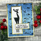 Card with a tall standing deer silhouette over the blue woodland background and 'May your days be Merry & Bright.'