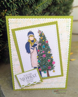 Green layered card with the girl in a blue hat and white apron by her pastel tree, mounted on a small 'MERRIEST SEASON' label.