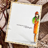 Minimalist card with the girl colored in bright orange and green at the right edge, and 'holding you close in my thoughts' in the open white space.