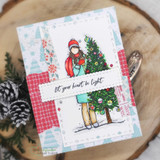 Patchwork card in aqua and red Christmas papers, the girl and her tree on a white panel over 'let your heart be light.'