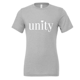The limited edition Unity tee in heather gray, shown flat, with the lowercase unity wordmark printed large across the chest and a small heart above the i.