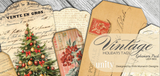 The Vintage Holiday Tags ephemera pack - a fan of aged tags printed with a Christmas tree, red berries, postal marks and old French text, with the pack label resting on top.