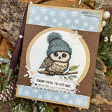 Kraft card with the owl in a teal beanie inside a snowflake circle and "Sending you all the cozy vibes"
