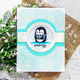 Card with the penguin in a circle on a frosty blue snowflake background and "warm hugs"