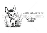 Red rubber stamp sheet with a soft eyed little donkey standing in tall grass, beside 'A LITTLE LOVE JUST FOR YOU' and 'Sending a smile'.