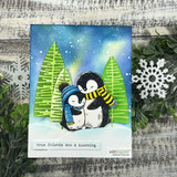 Northern-lights card with the penguin pair hugging between green trees — true friends are a blessing