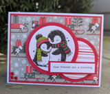 Christmas presents card with the hugging penguins in red circle — true friends are a blessing