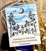 Card with the tree silhouettes over a blue watercolor sky and painted moon, lettered 'Kindness is like snow; it beautifies everything it touches.'