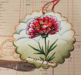 Scalloped tag of a red-tipped carnation with a ladybug above a scripted 'missing you'