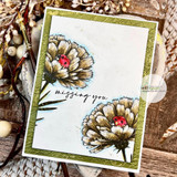 Olive-framed card of two sketched carnations with a red ladybug and 'missing you' script