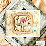 Card with pink wildflowers layered on a stitched frame over a soft floral background