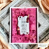 Grungy pink card with 'Let's drink wine & judge people' on a tag beside stamped bottles.