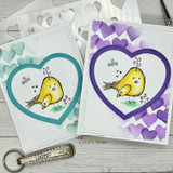 Two sample cards using the stencil, one with teal hearts and one with purple, each blended into a large open heart shape around a small stamped chick.