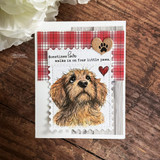 Card with the puppy on red plaid paper and "Sometimes love walks in on four little paws," a paw token