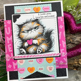Valentine card with the grumpy cat colored holding a red heart, pink conversation-heart accents, and the 'I love you, you're welcome' sentiment.