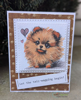 Paw-print framed card of a fluffy Pomeranian puppy with 'Let the tail-wagging begin!'