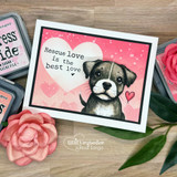 Pink heart-bokeh card of a pit bull puppy with 'Rescue love is the best love.'