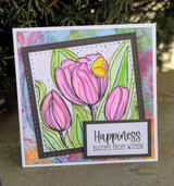Card of pink tulips with a butterfly framed on a soft panel.