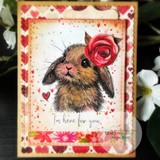 Luna, a gentle lop-eared bunny hand-stamped on a card and lettered "Need anything?."
