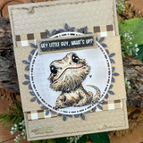 Kraft laurel-framed card of Bruce with textured embossing and leaf accents.