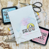 Handmade card featuring a cheerful waving bunny with a fluffy tail, with the sentiment "Some bunny loves you."