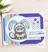 Rainbow-striped card with the grumpy cat in bunny ears, captioned 'Spring is in the air... and so is my attitude.'